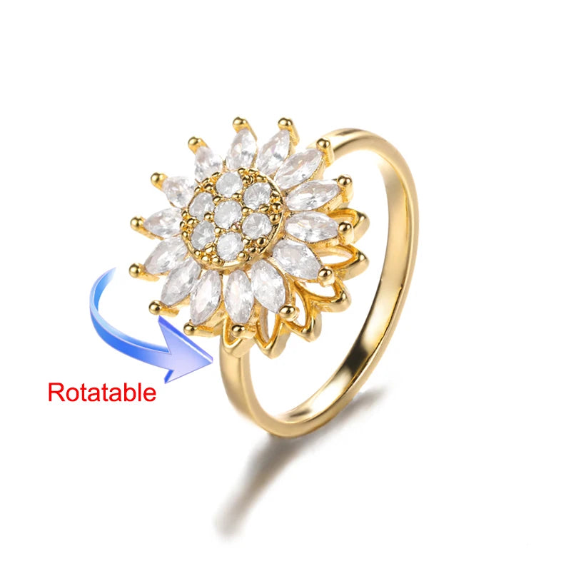 Rotating anxiety ring with clover design