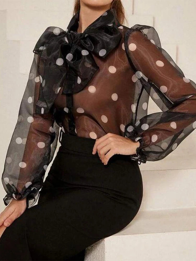 Polka dot blouse with lace-up detail