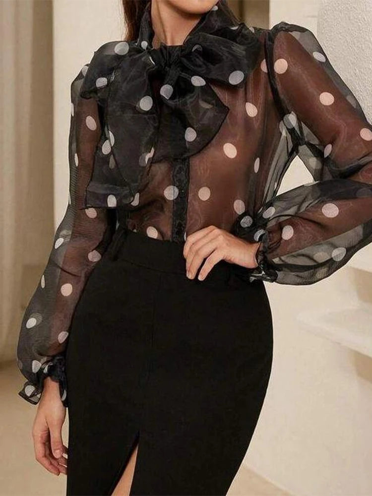 Polka dot blouse with lace-up detail