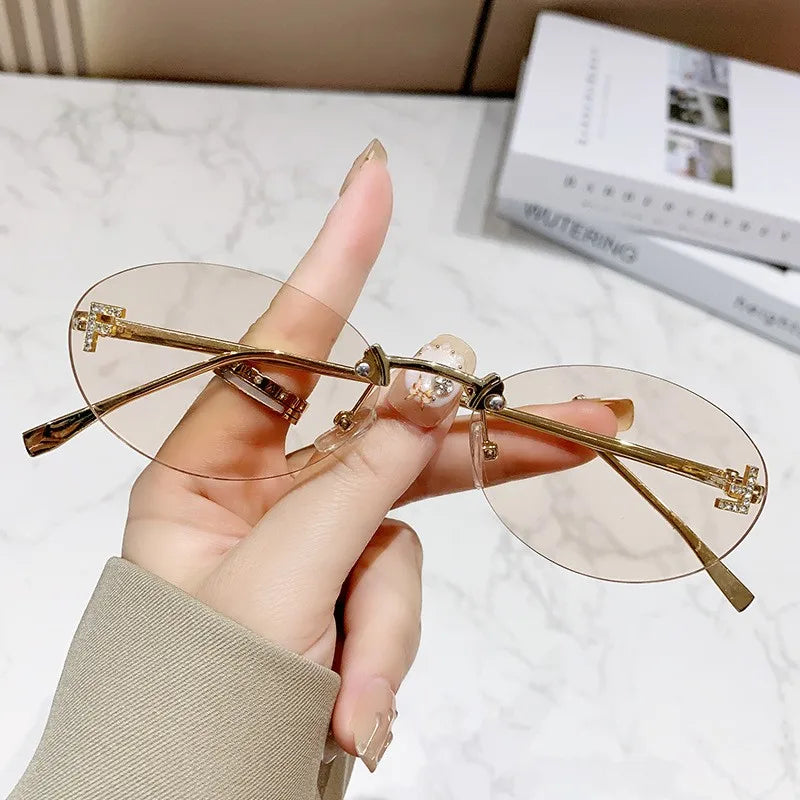 Rimless Sunglasses with 'F' Detail and Elegant Oval Style