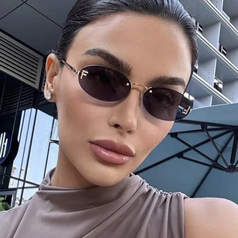 Rimless Sunglasses with 'F' Detail and Elegant Oval Style