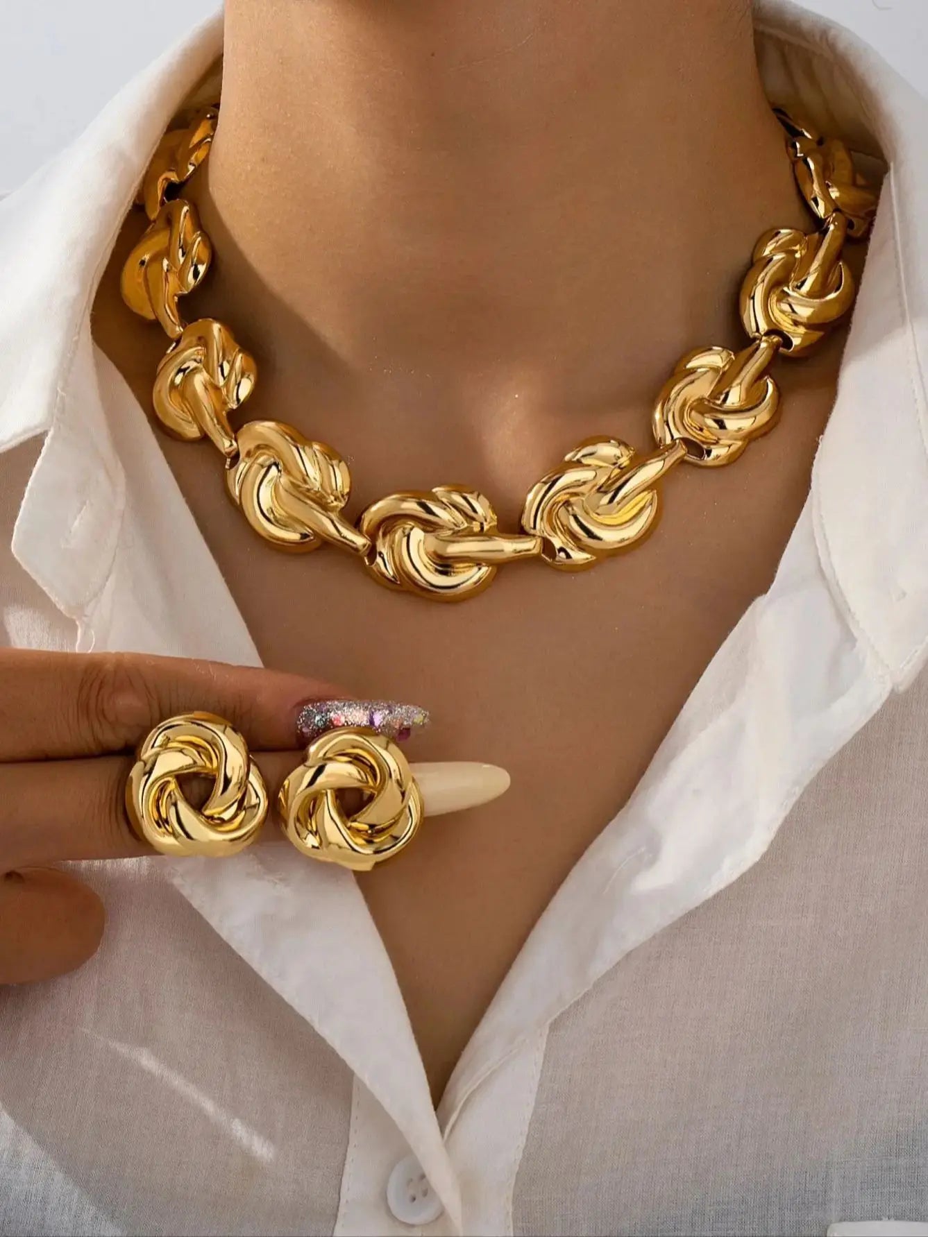 Gold tone jewelry set with necklace earrings bracelet