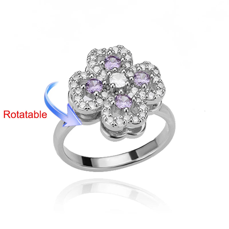 Rotating anxiety ring with clover design