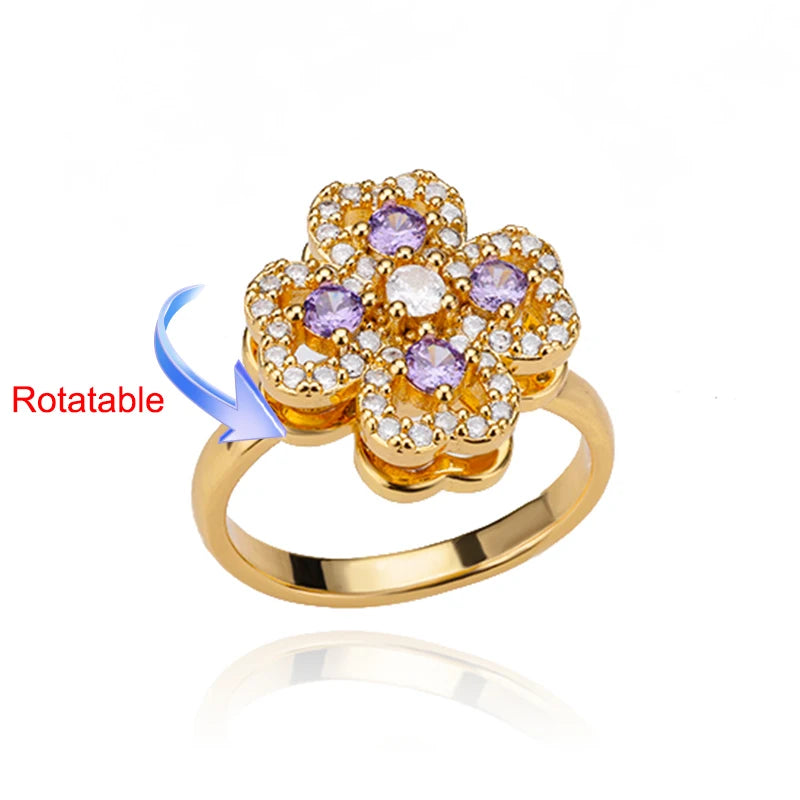 Rotating anxiety ring with clover design