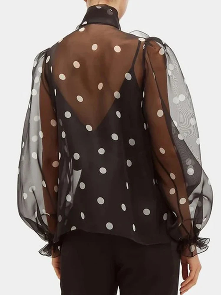 Polka dot blouse with lace-up detail