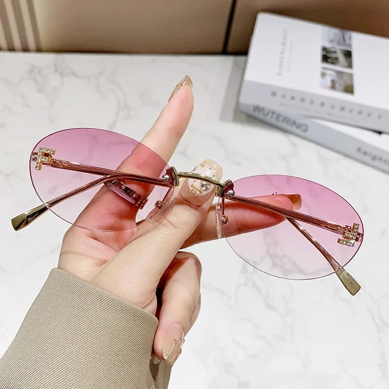 Rimless Sunglasses with 'F' Detail and Elegant Oval Style