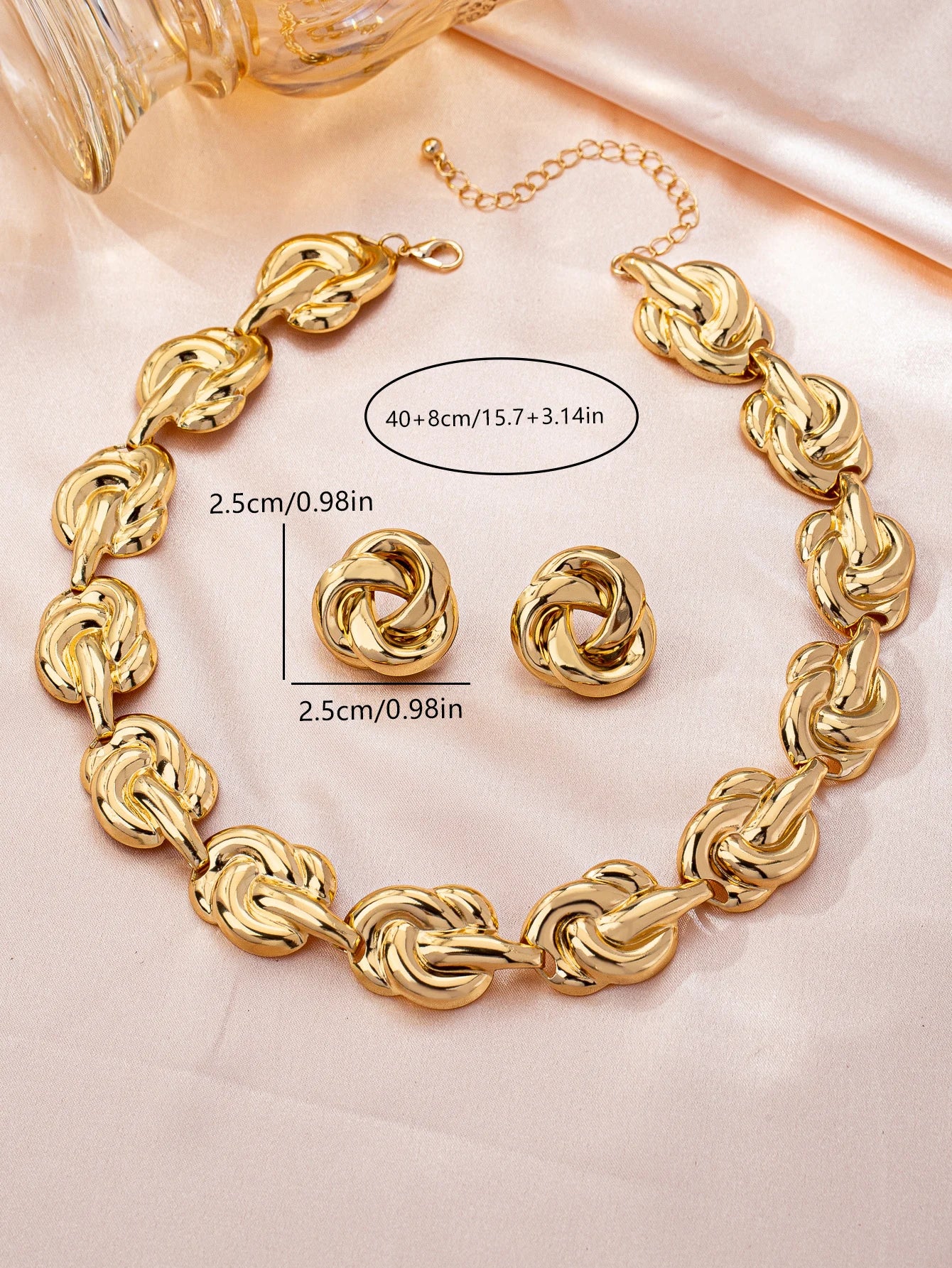 Gold tone jewelry set with necklace earrings bracelet