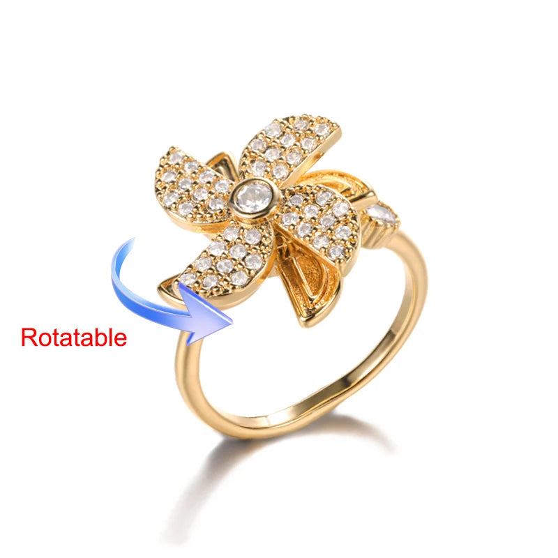 Rotating anxiety ring with clover design