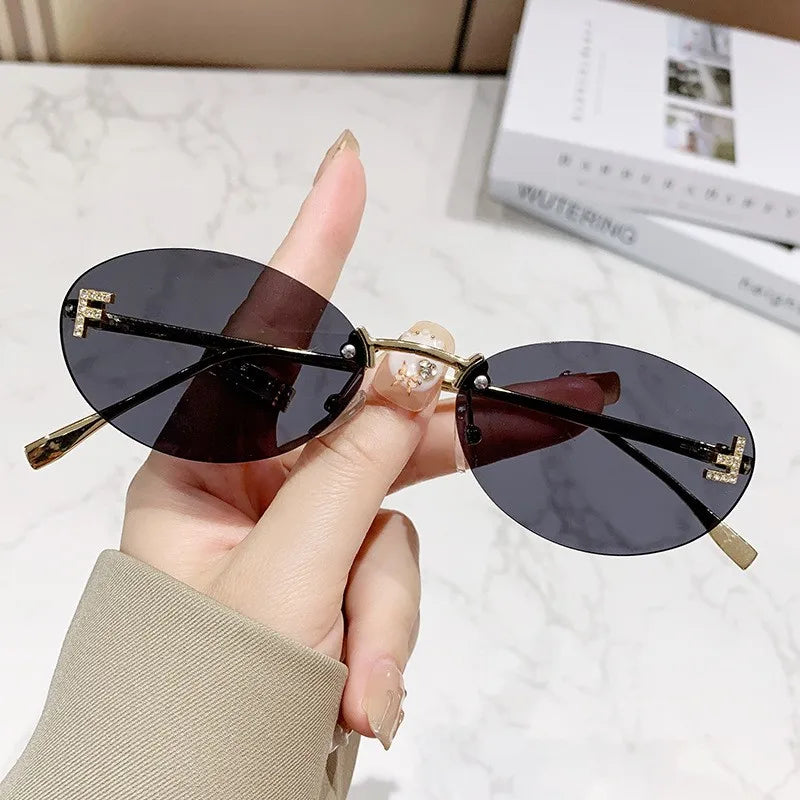 Rimless Sunglasses with 'F' Detail and Elegant Oval Style