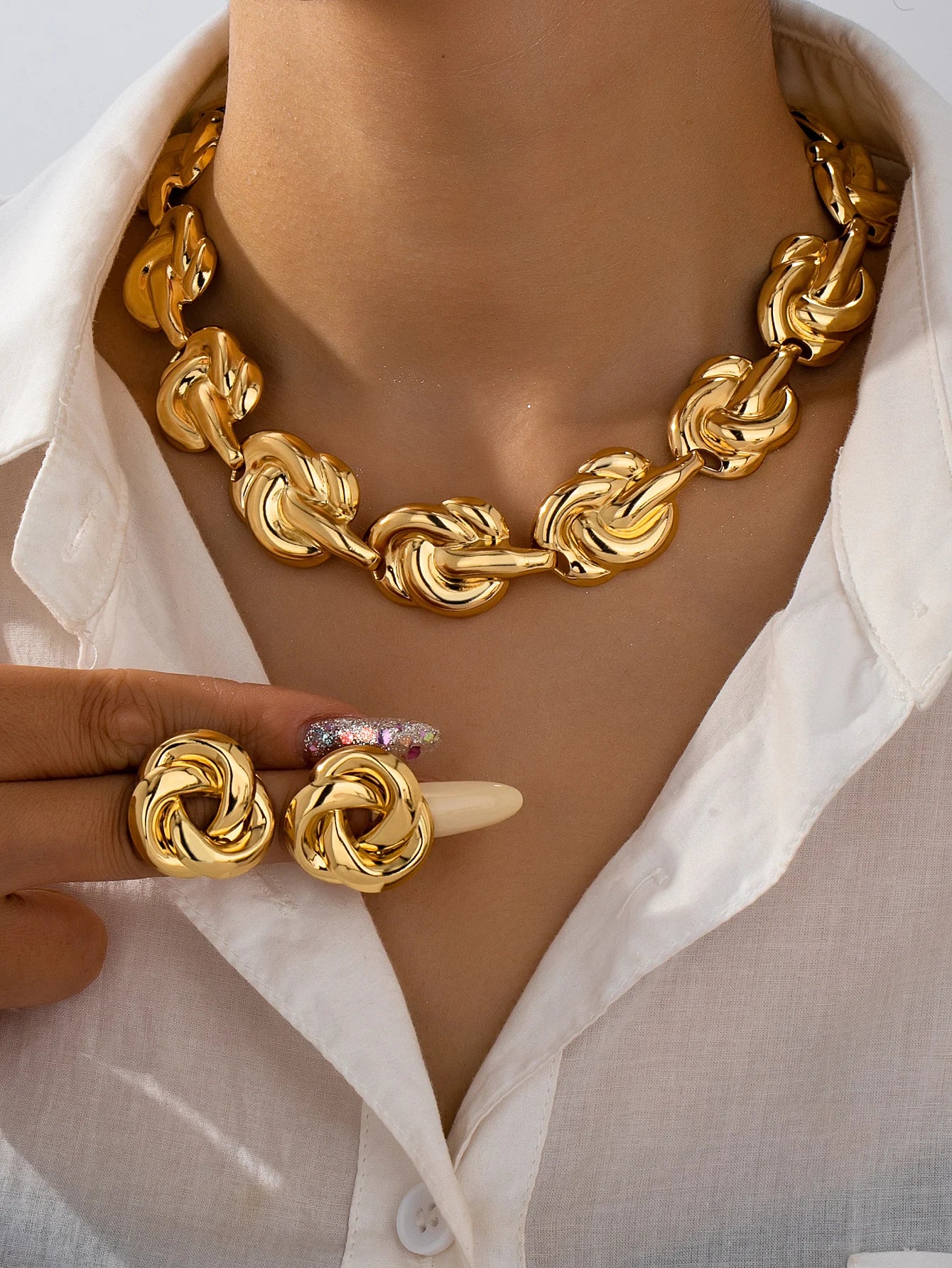 Gold tone jewelry set with necklace earrings bracelet