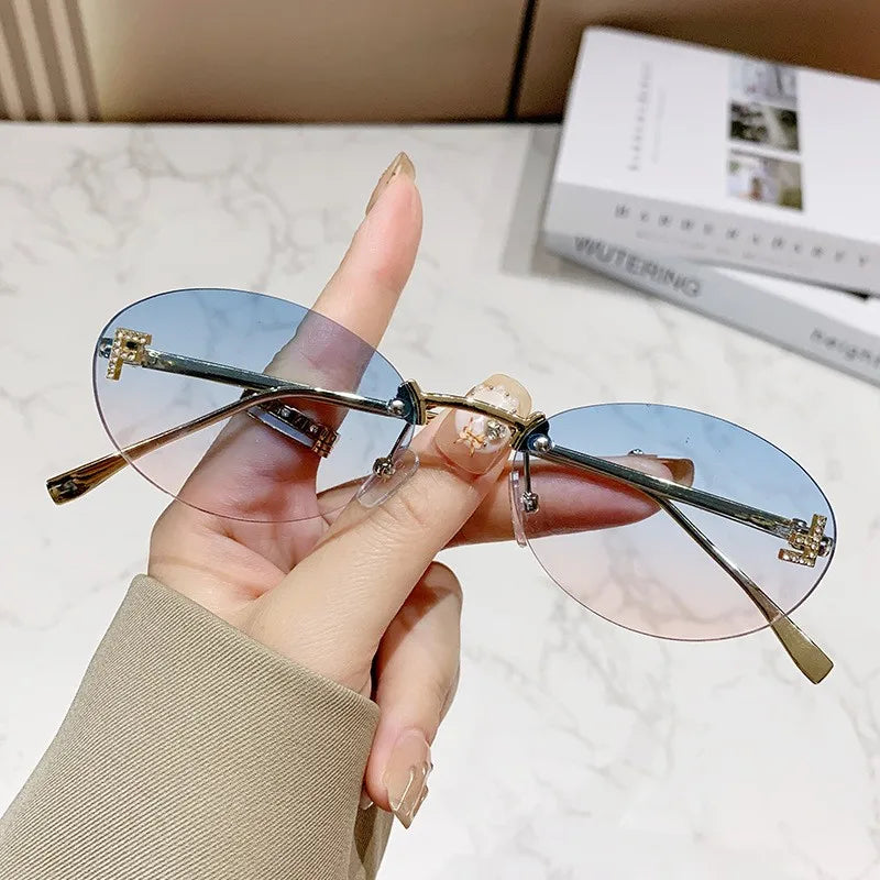Rimless Sunglasses with 'F' Detail and Elegant Oval Style