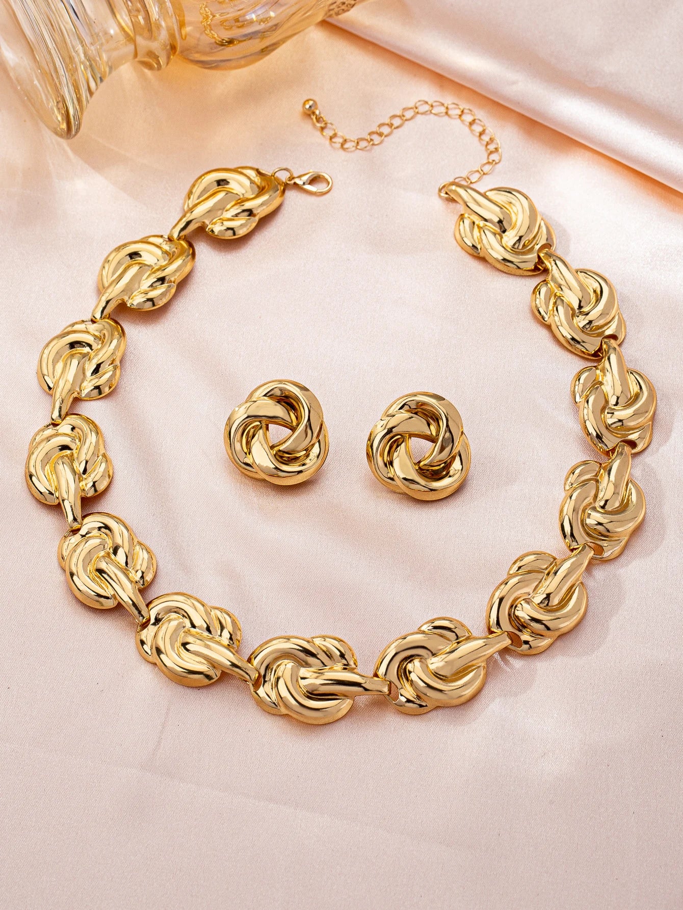 Gold tone jewelry set with necklace earrings bracelet