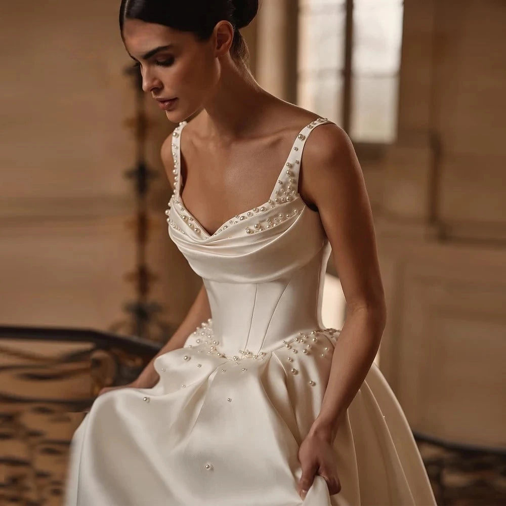 A line satin wedding dress with thin straps