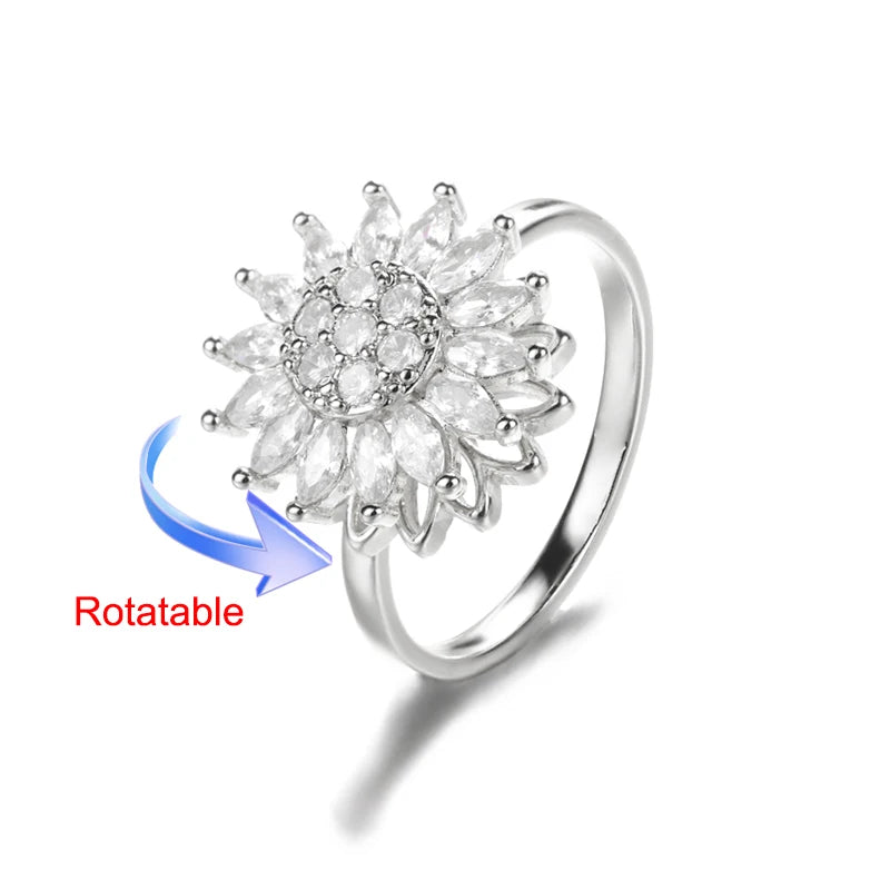 Rotating anxiety ring with clover design