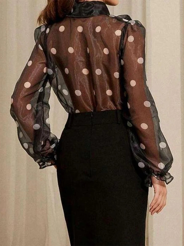 Polka dot blouse with lace-up detail