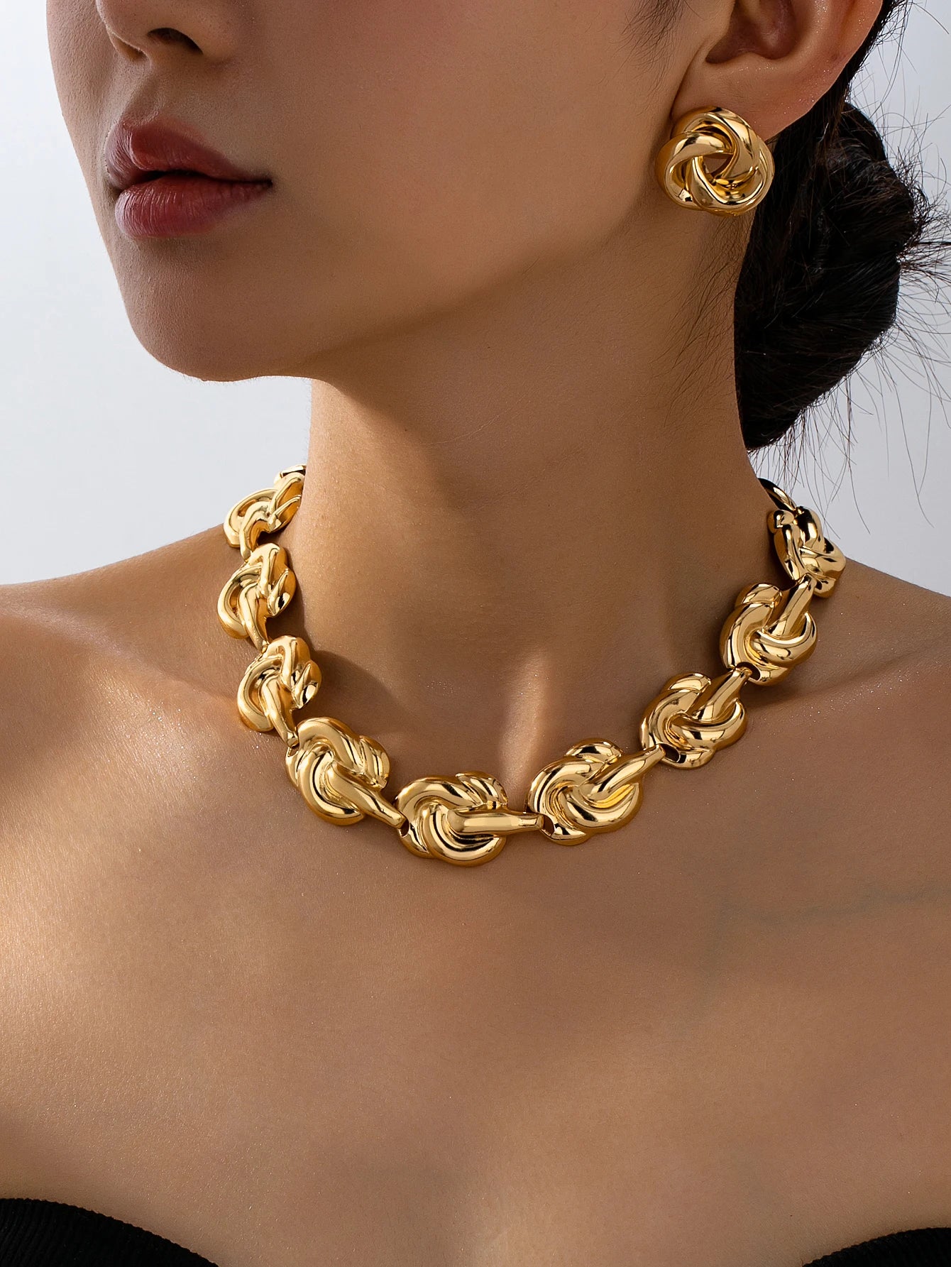 Gold tone jewelry set with necklace earrings bracelet