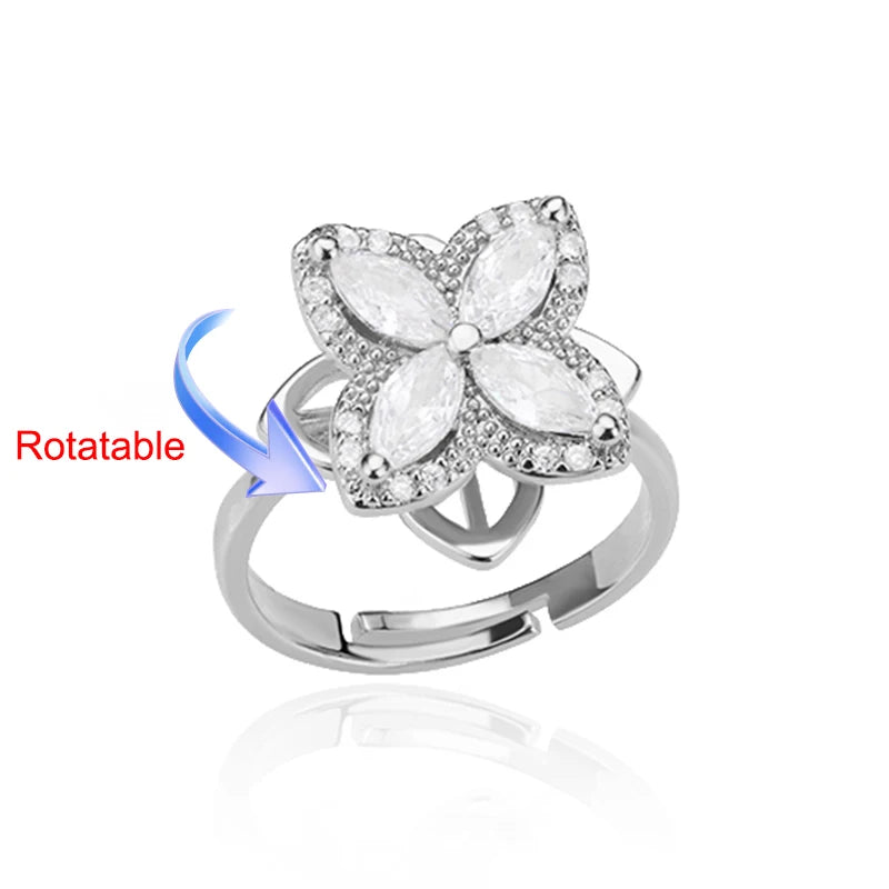 Rotating anxiety ring with clover design