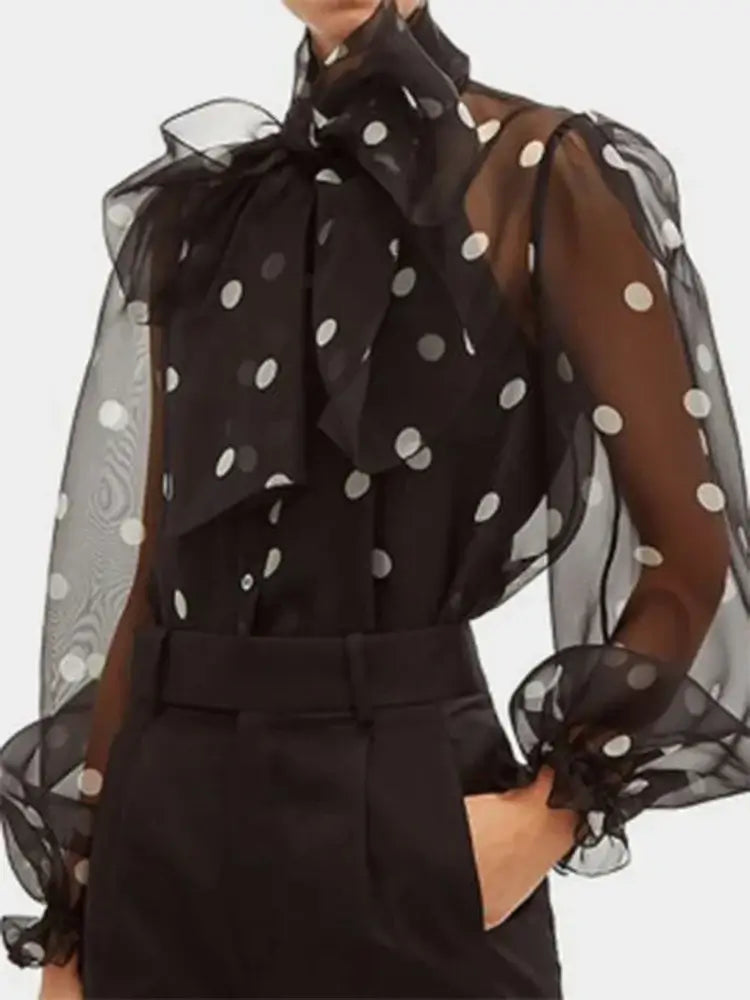 Polka dot blouse with lace-up detail