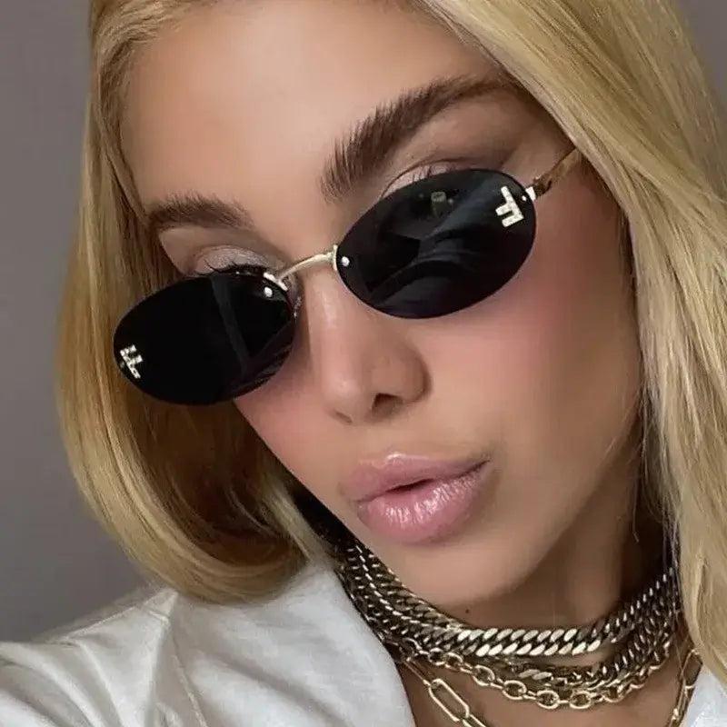 Rimless Sunglasses with 'F' Detail and Elegant Oval Style