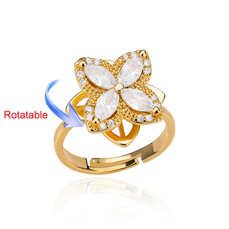 Rotating anxiety ring with clover design